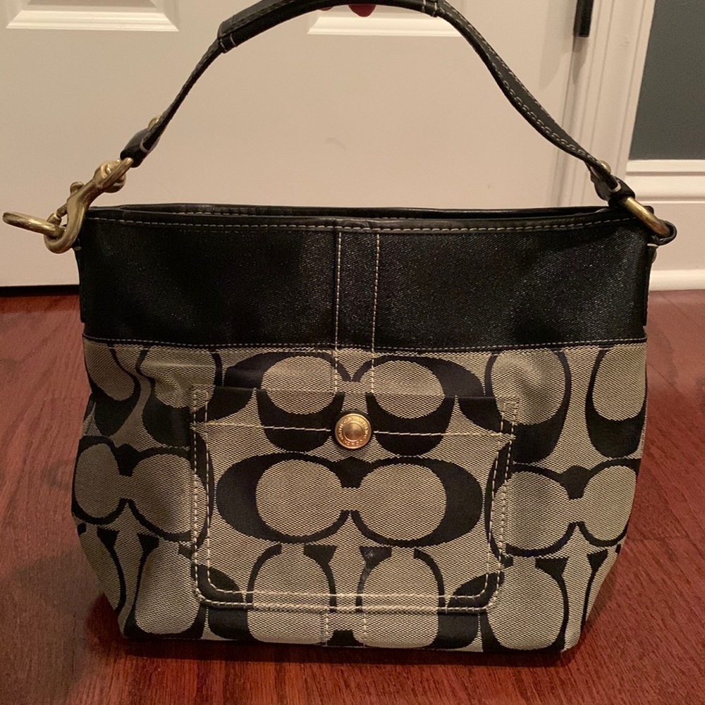 Signature black coach purse with leather accents